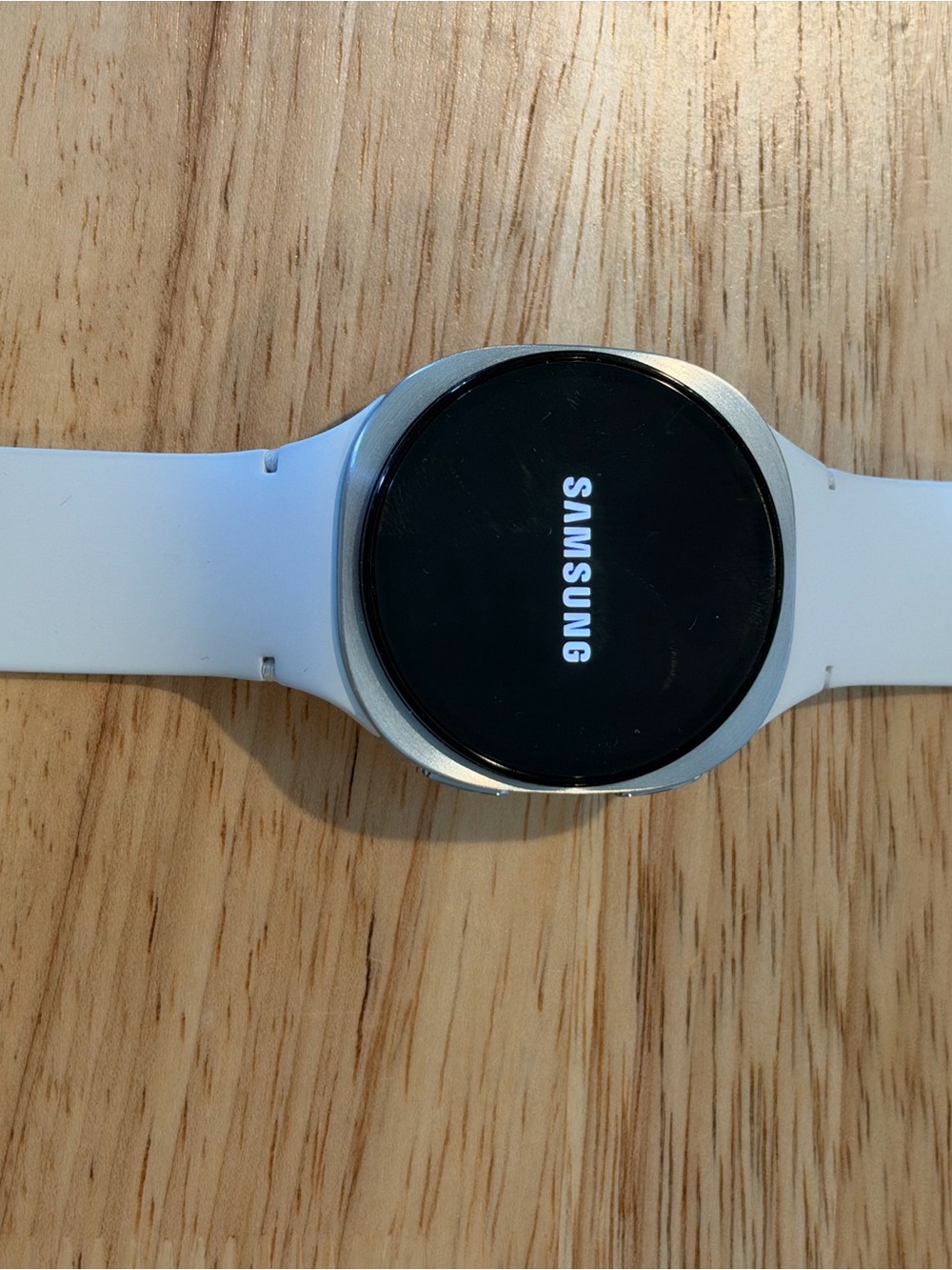 Samsung Smartwatch with White Silicone Band and Silver Bezel